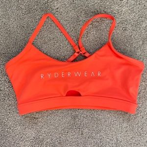 Ryderwear Women’s sports bra, Size S. Colored peachy-orange. Lightly used